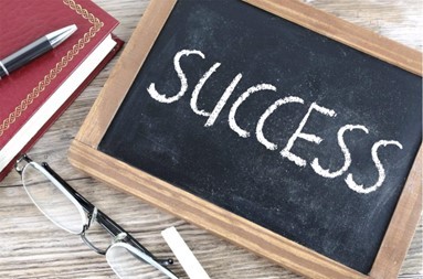 The word success written on a student chalkboard